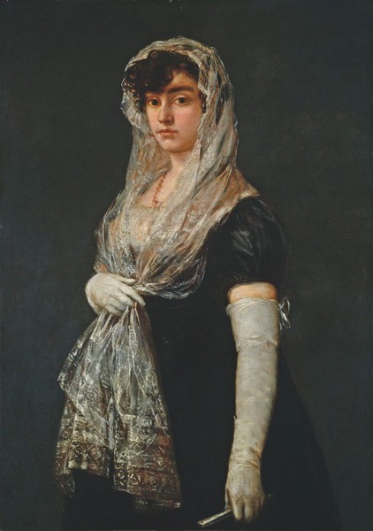 Mujer joven con mantilla y basquiña